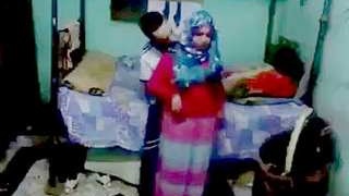 A charming South Asian girl engages in oral and sexual intercourse with her boyfriend while wearing a hijab