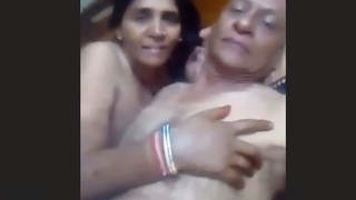 Indian elderly man and woman engaging in sexual activity