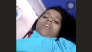 Attractive young woman pleasuring herself with fingers