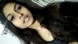 A stunning Indian babe seductively strips