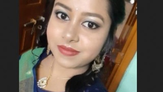 Sensual Mou, a Bengali beauty with big breasts, in a tantalizing video