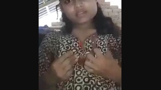 Aroused village girl pleasures herself with a banana