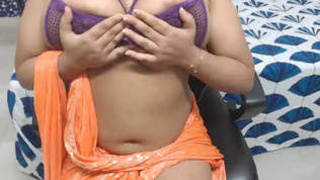 Attractive curvy Mona showcases her large breasts