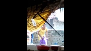 Indian beauty bathes outdoors in the sun