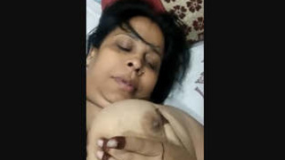 Indian wife flaunts her large breasts in front of the camera