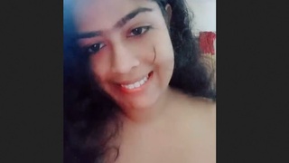 Indian college girl seductively displays her large breasts