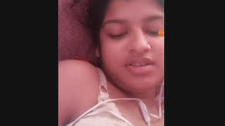 A seductive Indian beauty reveals her breasts and intimate area