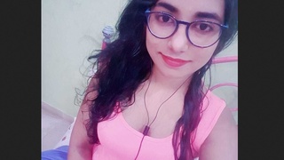 A charming South Asian woman showcases her attractive physique in this recording