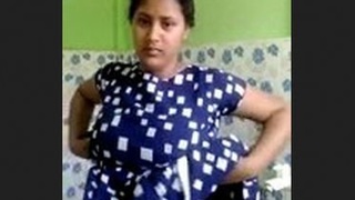 Beautiful Indian wife beautifies her face before bath