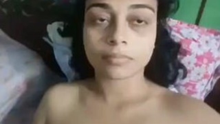 Aroused college woman pleasuring herself