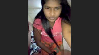 Indian woman covertly taking self-portraits in workplace