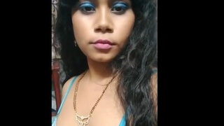 A naughty Indian wife reveals her breasts