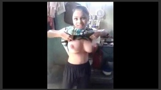 Kamya's large breasts are prominently featured in this video