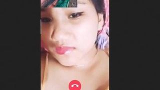 An Assamese teenager reveals her breasts