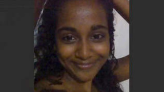 A Sri Lankan woman displays her large breasts