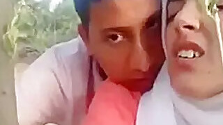 Desi Judwa Bhai Bahan Latif Litifa, a Muslim woman wearing a hijab outdoors doggy-style