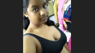A beautiful South Indian girl of Indian descent teases her boyfriend with her big breasts