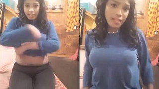 Alluring girl reveals her curves and sways her breasts in a live performance with audio