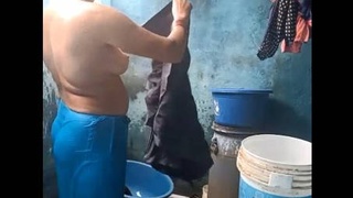 South Asian aunt undresses and misbehaves in the bath
