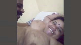 A curvy woman with large breasts and her spouse