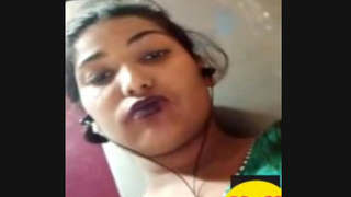 Aroused Indian woman pleasures herself by licking and fingering her vagina during a video call