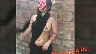 Ravina's sensual performance without a top