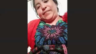 Elderly Nepalese woman displaying herself