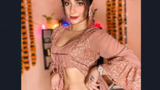 A well-known woman's breasts unintentionally revealed in a heated recording