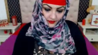 Desi aunt in hijab uses a large toy for self-pleasure and makes loud sounds