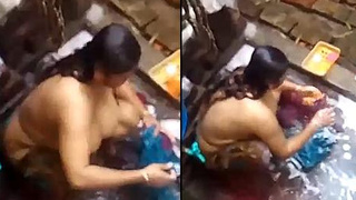 Desi bhabi strips down to wash clothes by hand