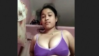 Asian teen girl flaunts her assets