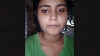 Arousing Indian woman reveals her breasts and moist vagina