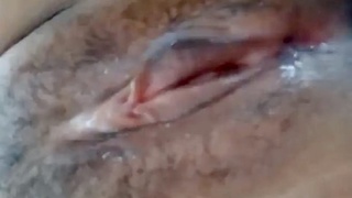 A husband lovingly stimulates his wife's genitalia with his mouth