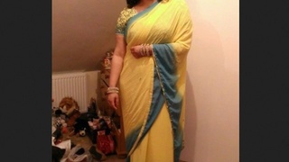 A Pakistani woman reveals her breasts and genitals