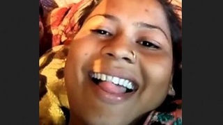 Waafiyah, an Indian woman with large breasts, displays them in a rural setting