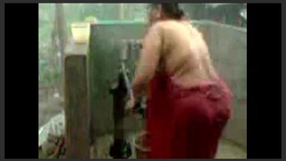 Indian wife uses a shower pump to cleanse herself