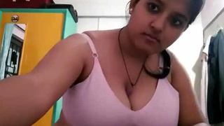 Ankita, a Bengali girl, indulges in self-pleasure and sucks her ample bosom in a video