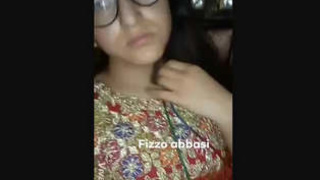 Stunning woman reveals and fondles her ample bosom