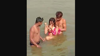 A young woman from a rural community has a pleasant experience with two men near a body of water.