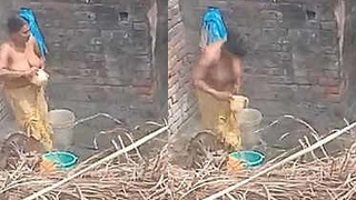 Indian aunt takes outdoor bath