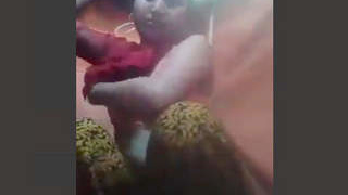 Indian wife playfully hinting at breastfeeding